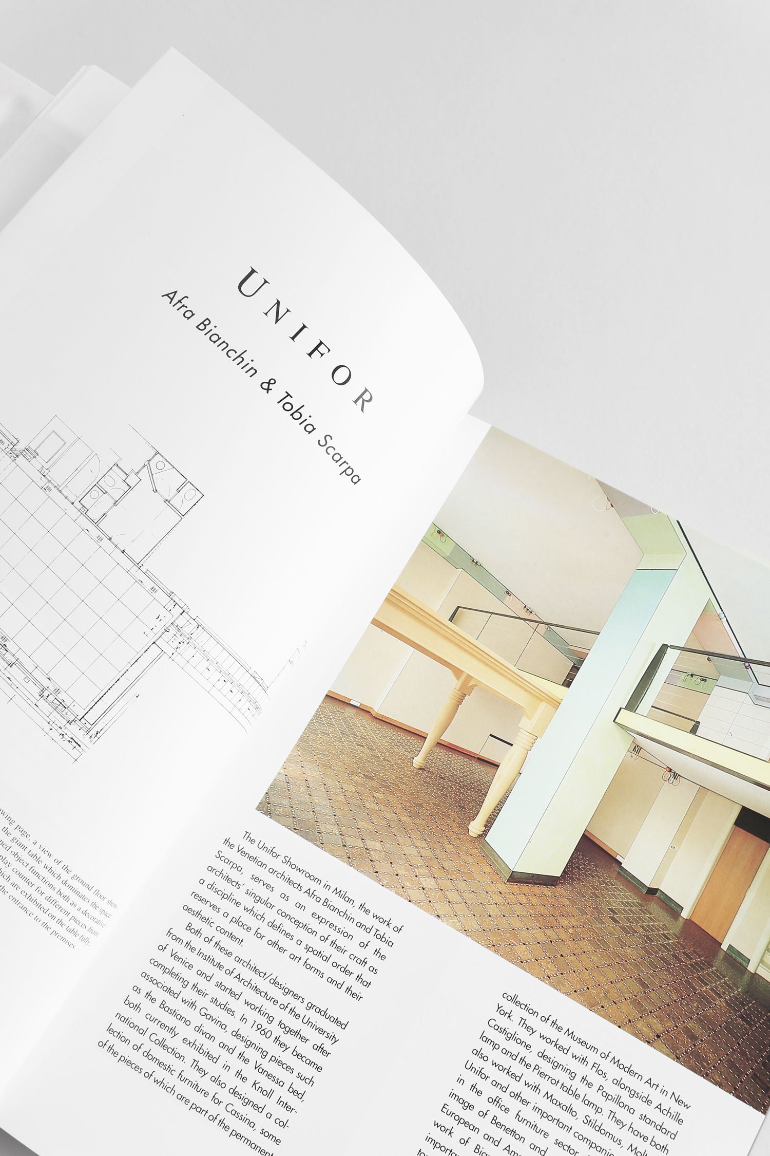 An open 'Commercial Space: Offices, Design and Layout' book by Villa showcases architectural drawings on the left and a modern office interior with columns and angled beams on the right—ideal inspiration for architecture enthusiasts.