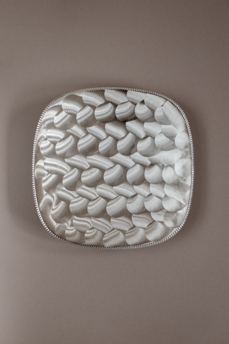 Silver-plated decorative dish with textured petal pattern interior