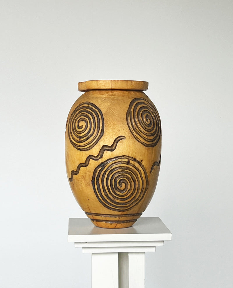 Hand carved wooden vase with spiral motifs by Porter Studio
