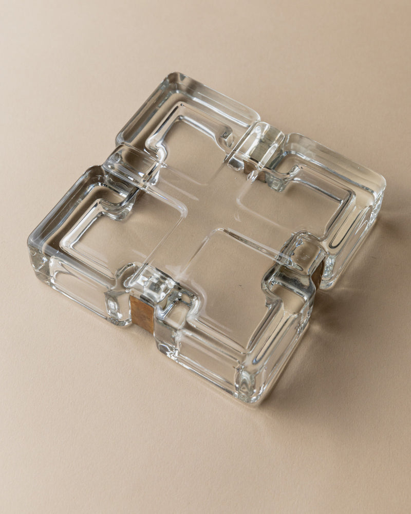 Clear glass ashtray with geometric square design and corner rests