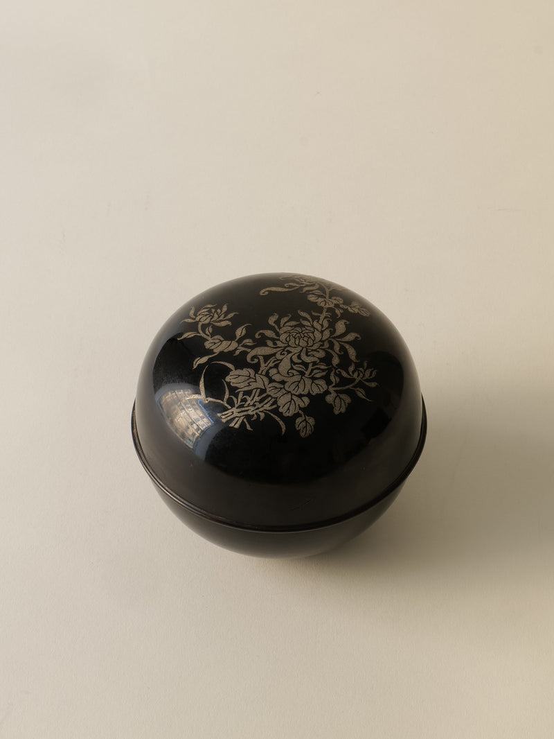 Black lacquered pewter box with gold floral motifs from 1920s