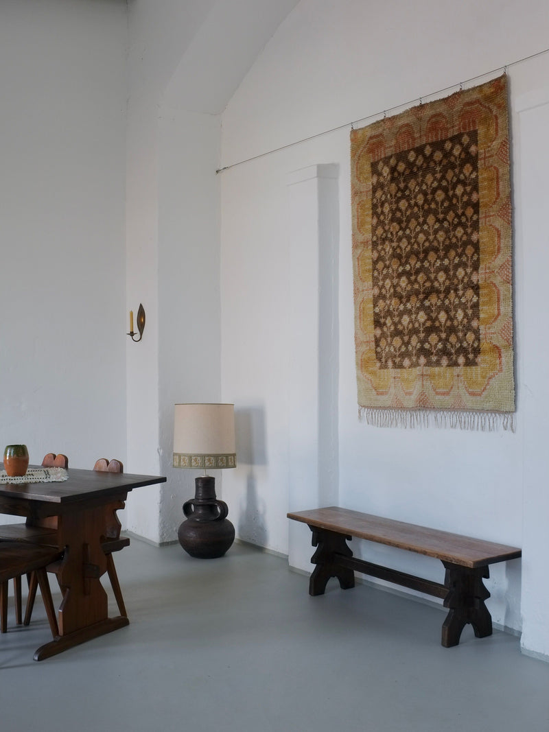 Brutalist ceramic floor lamp styled in minimalist dining room