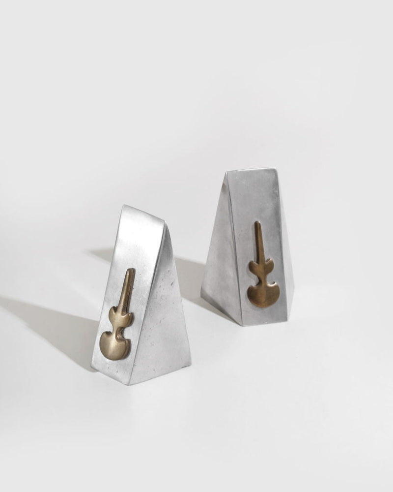 Modernist concrete bookend set with brass guitar details