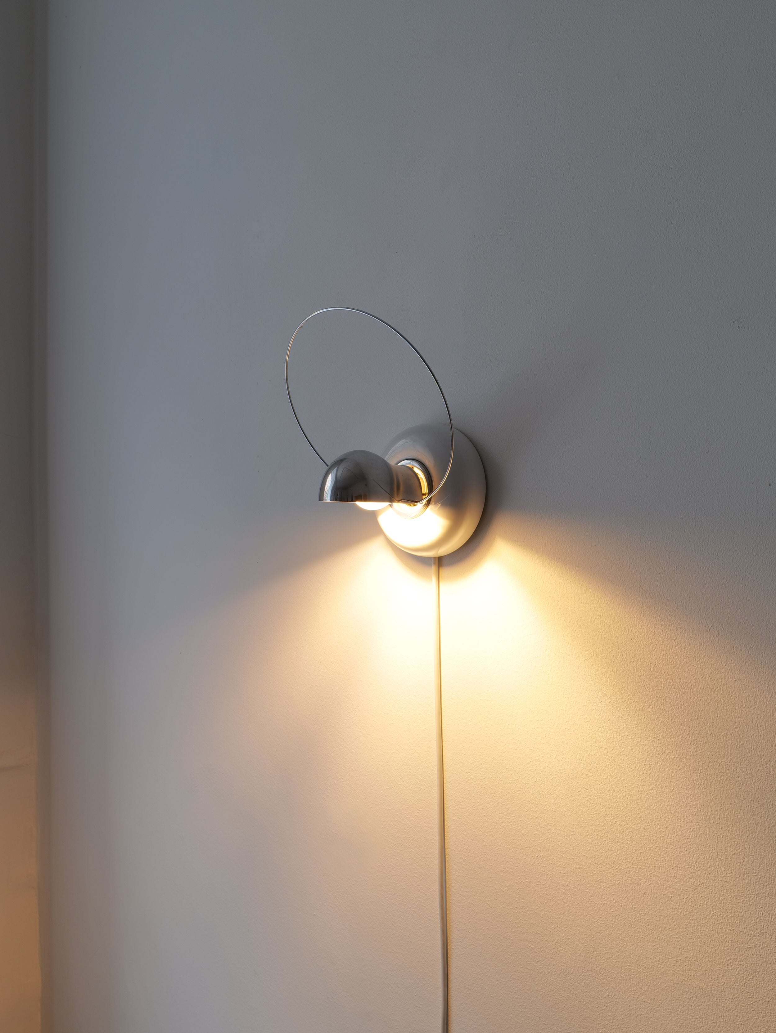 Bisbi Wall Sconces by Achille Castiglioni for a sophisticated lighting solution