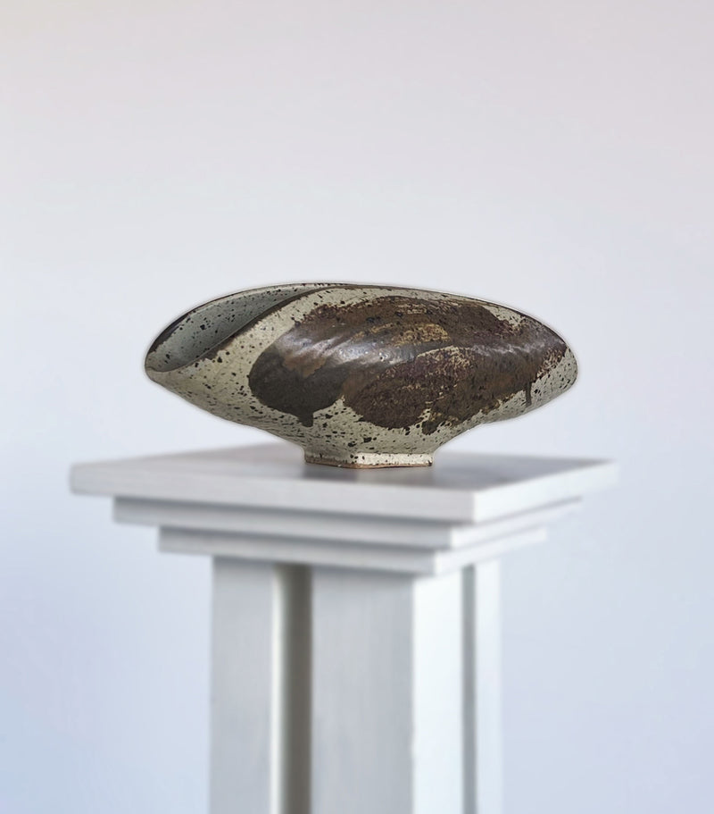 Ceramic sculptural dish with speckled glaze by Porter Studio