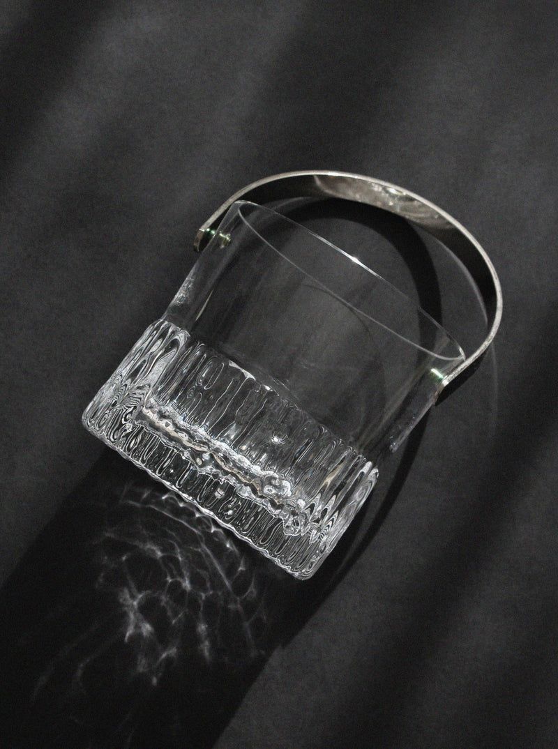 Crystal ice bucket with ribbed base detail and curved handle by Göran Wärff