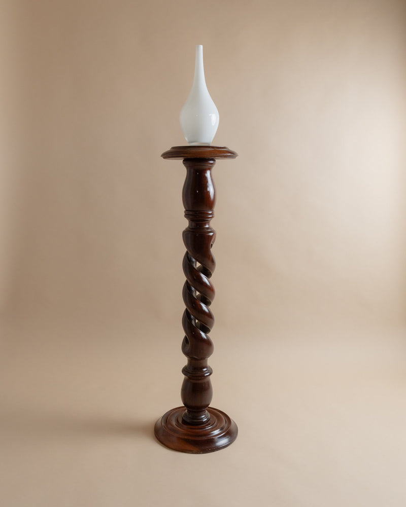 Twisted wood pedestal column with white glass flame detail
