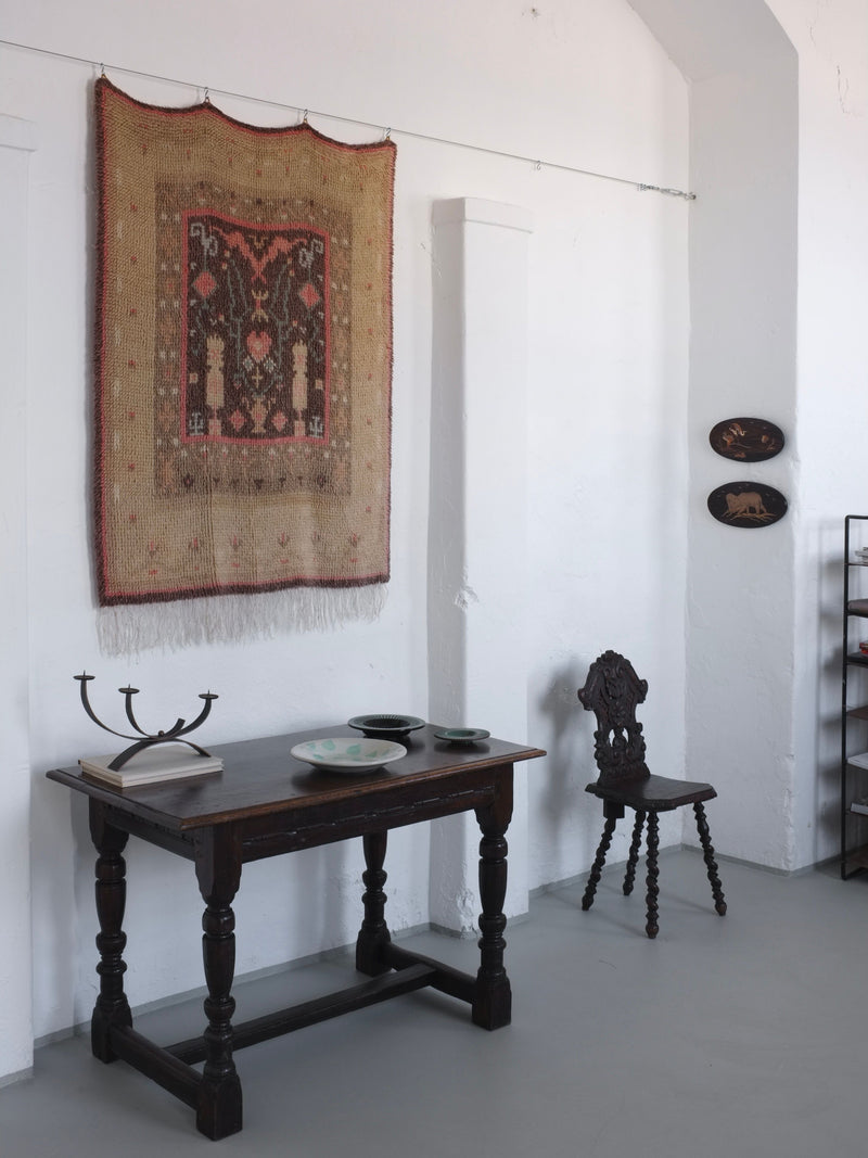 Vintage Finnish rya wall rug displayed in styled interior setting