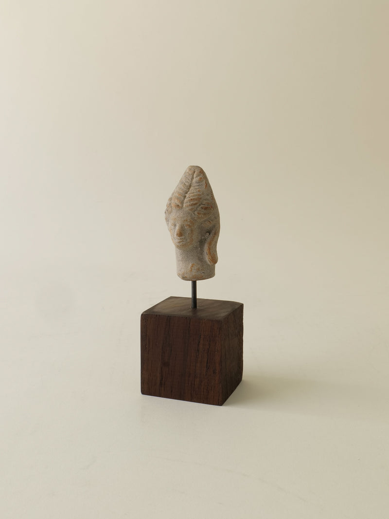 Ancient stone Hera sculpture head mounted on dark wooden base