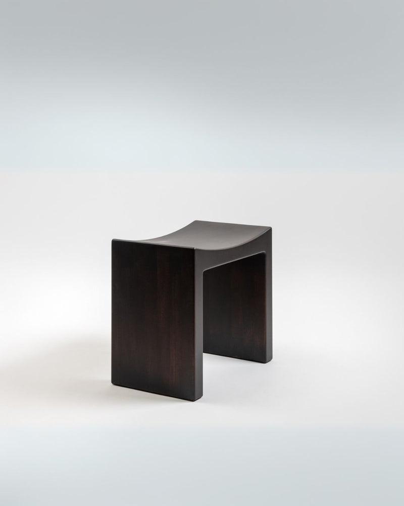 Black curved stool with open frame design by Giuseppe Rivadossi