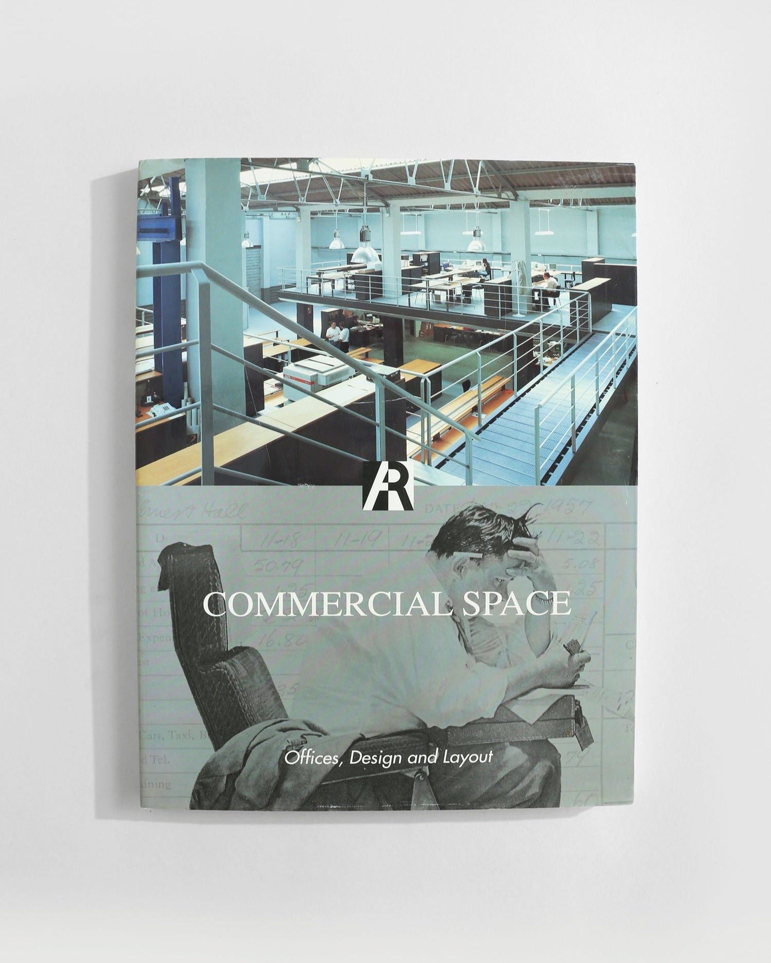 The 'Commercial Space: Offices, Design and Layout' book by Villa features a modern open-plan office cover image blended with a grayscale photo of someone reading vintage books, capturing both contemporary and timeless interior design.