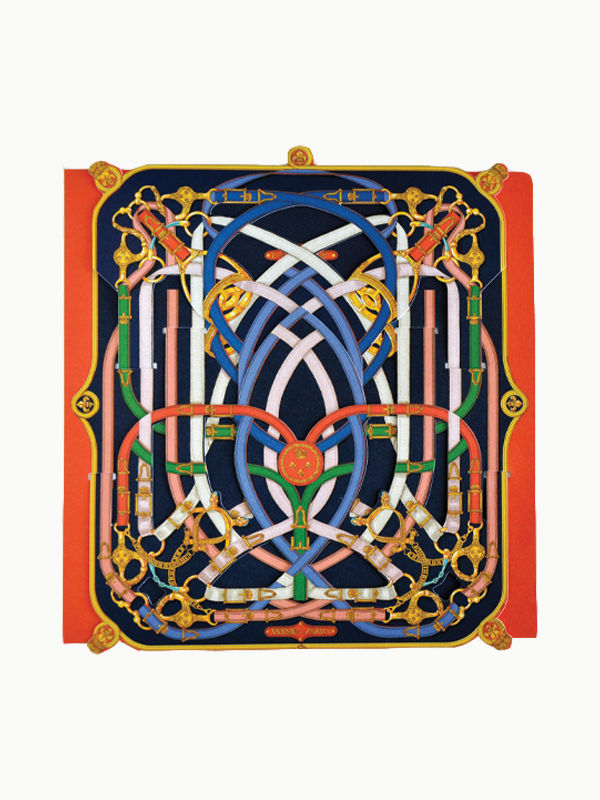 A detailed symmetrical design showcasing interwoven blue, pink, and gold lines on a dark background, bordered by red and gold ornamental elements. Resembling the intricate patterns found in Hermès Pop Up Book by Maison Plage, this complex labyrinth-like motif features a central red emblem.