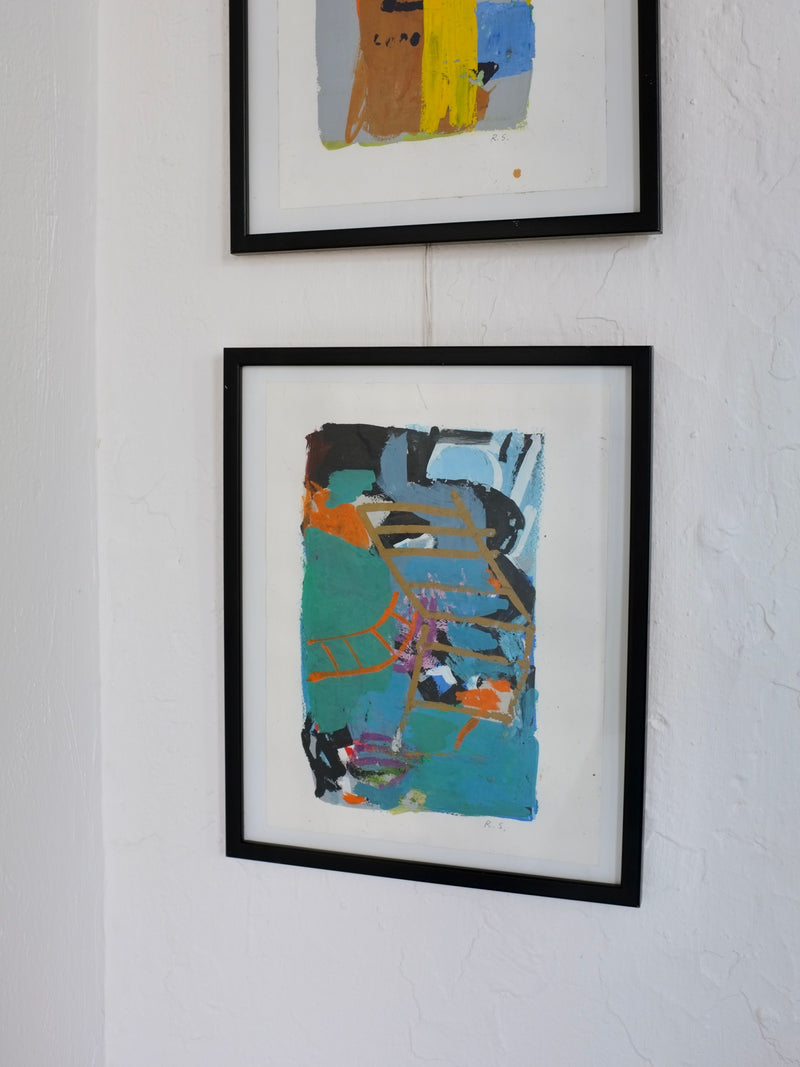 Two framed abstract paintings with vibrant brushstrokes on white wall