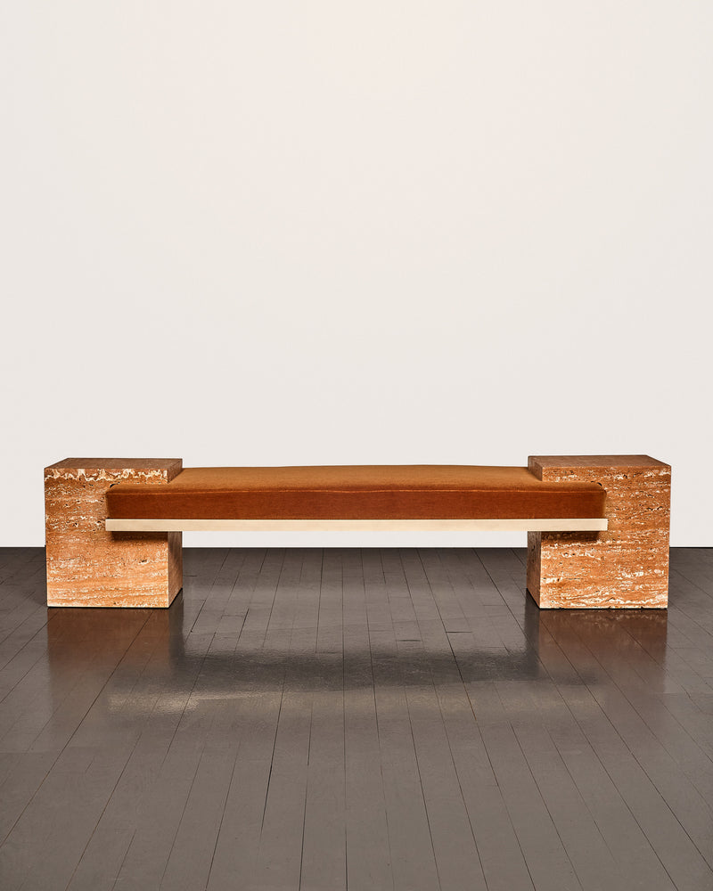 Coexist orange travertine bench with geometric block supports