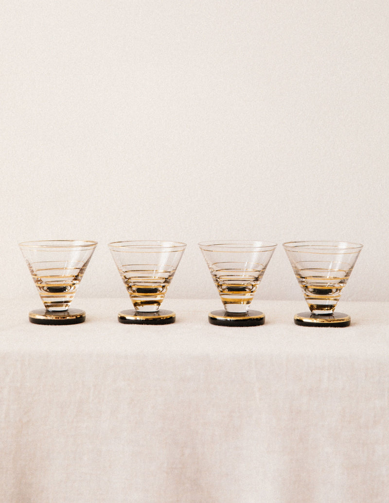 Set of four gold-rimmed cordial glasses with horizontal stripes