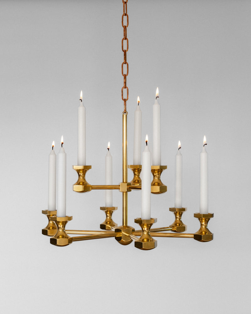Monumental brass candle chandelier with lit white tapers, 1980s
