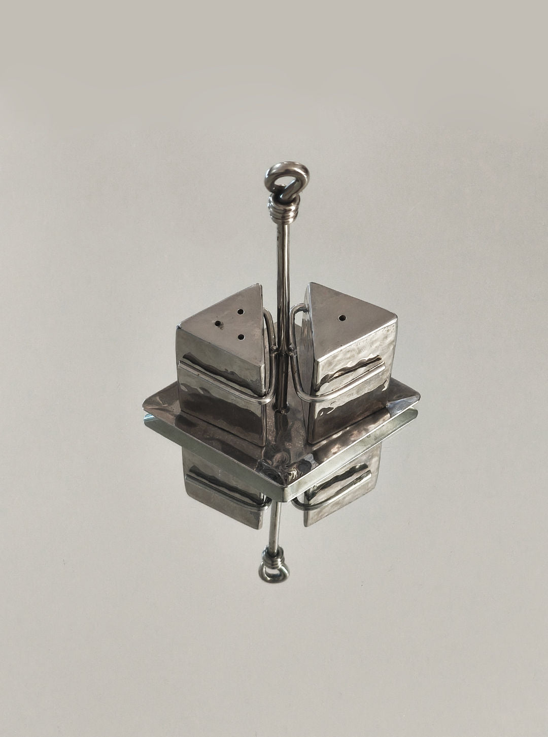 Polished chrome salt and pepper shakers with carrying handle
