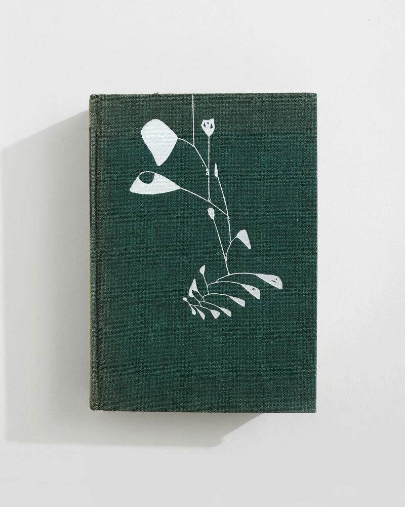 Green cloth-bound American art book with white botanical design