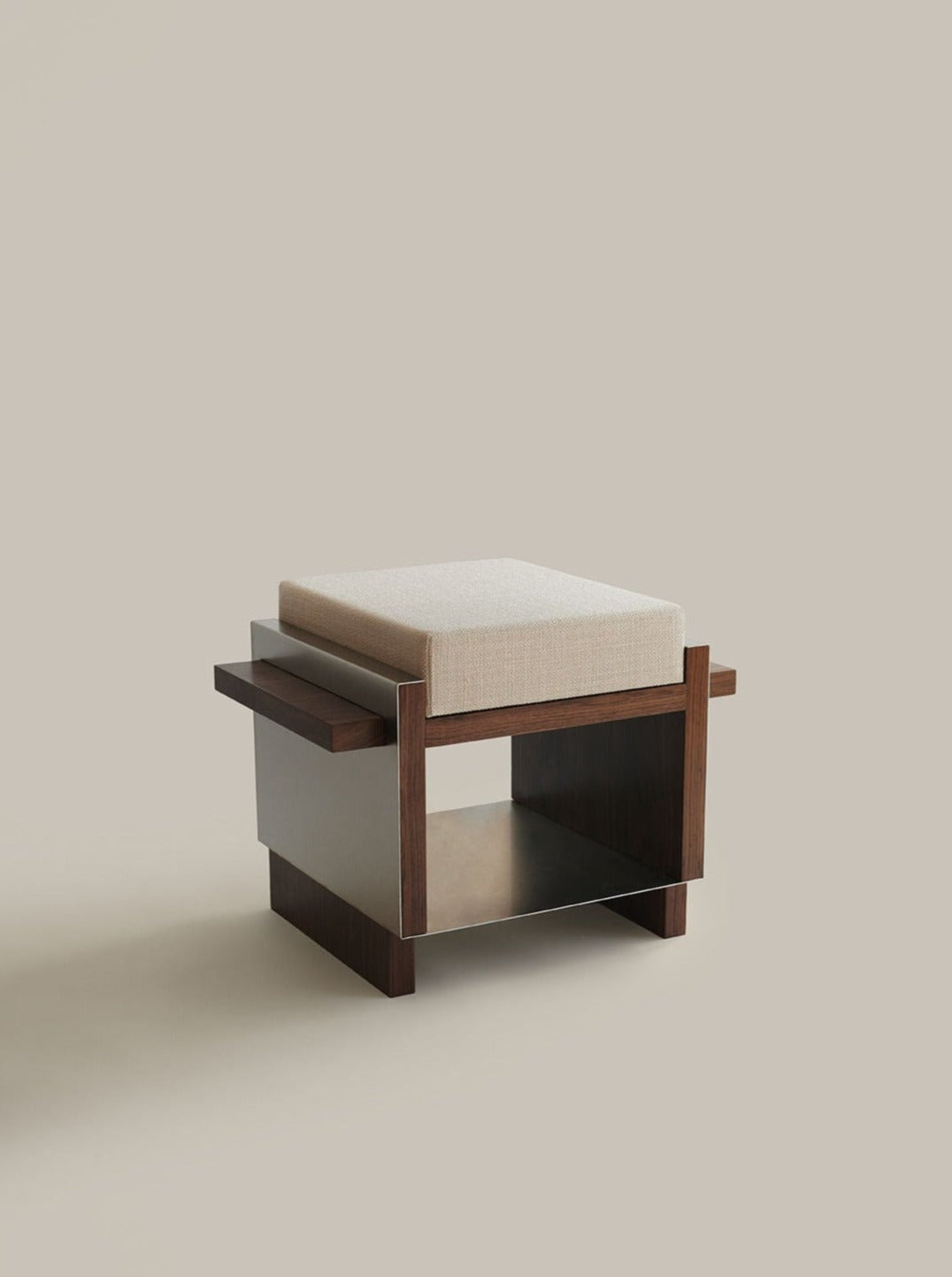 A modern, minimalist B1 [single stool] by Sofia De=Francesco with a dark walnut wood frame, beige cushioned seat, and open storage space underneath. The design features horizontal wooden slats on the sides and a sleek, rectangular form. The neutral background highlights the B1 [single stool]'s contemporary design.