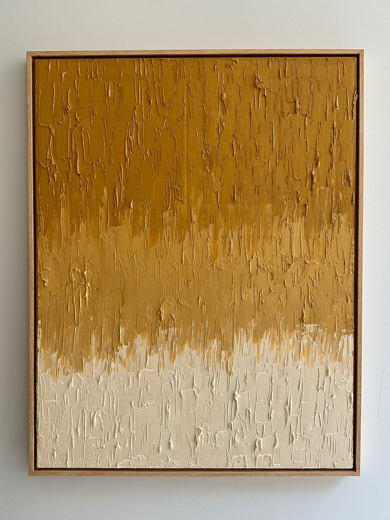 Introducing the "Ochre Yellow Faded" by Roi Elmaliah, this oil on canvas piece showcases textured brush strokes. It features a rich earthy brown in the upper section that smoothly transitions into a lighter beige hue at the bottom. The artwork evokes the spirit of Amsterdam's art scene and is elegantly presented in a simple wooden frame.