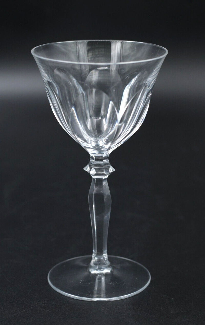 A set of 6 Peill & Putzer crystal wineglasses by Flock Studio, featuring clear faceted designs and decorative stems, displayed against a plain dark background.