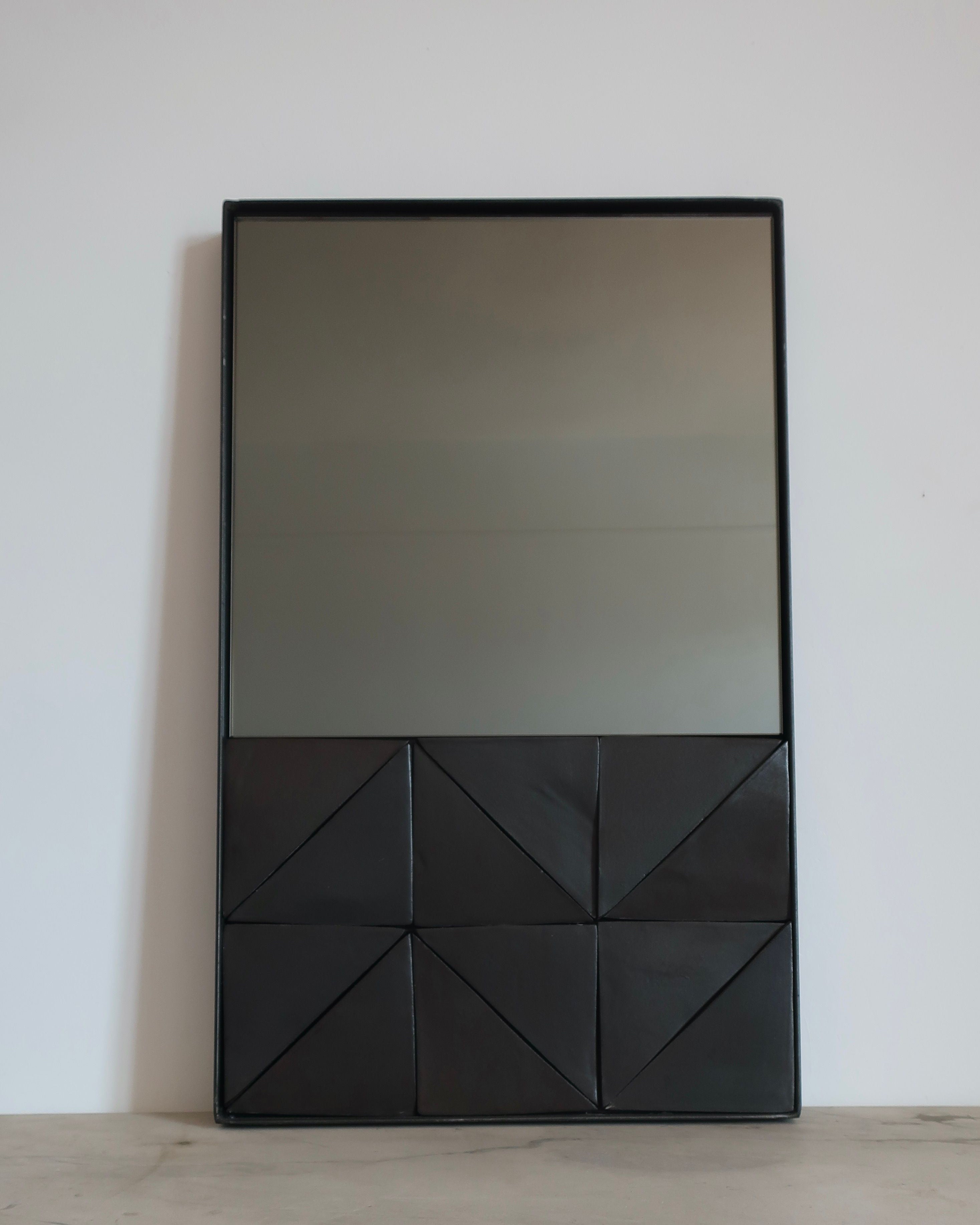 Black framed Alcoa mirror with geometric pattern and bronze glass