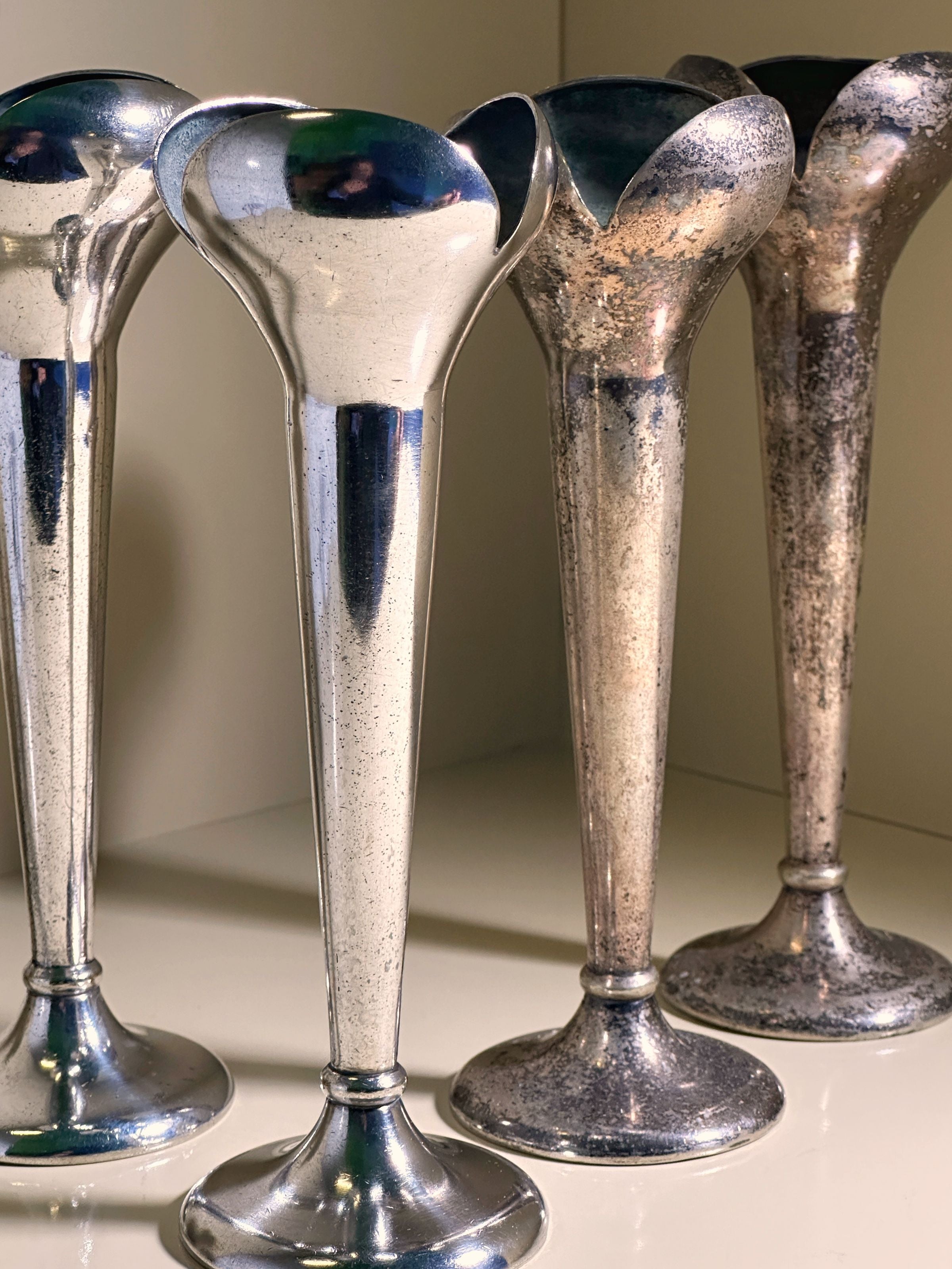 Four tall, narrow vintage vases with an Alpacca silver finish and flared openings display a classic design akin to Dodo Vintage's Set of 2 Candlesticks by Gio Ponti for Calderoni from the 1930s.