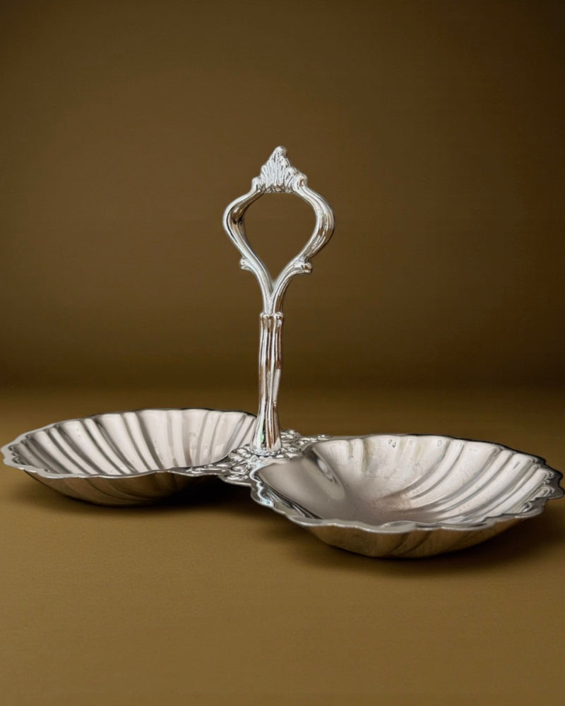 Elegant silver double shell serving dish with ornate handle