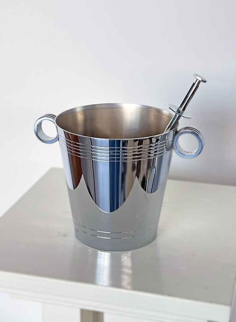 Polished stainless steel ice bucket with chrome handles and picker