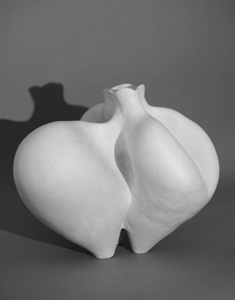 White ceramic sculptural vase with curved organic forms by Siham Djebbar