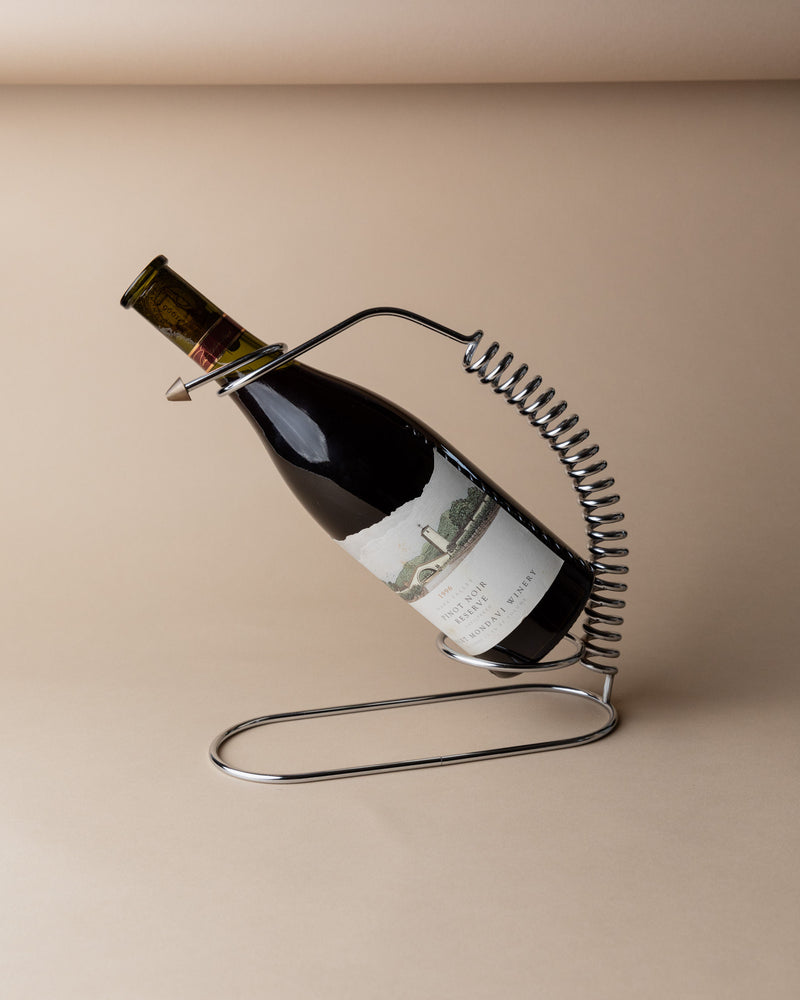 Chrome wire bottle holder with spiral design holding wine bottle, Italy 1980s