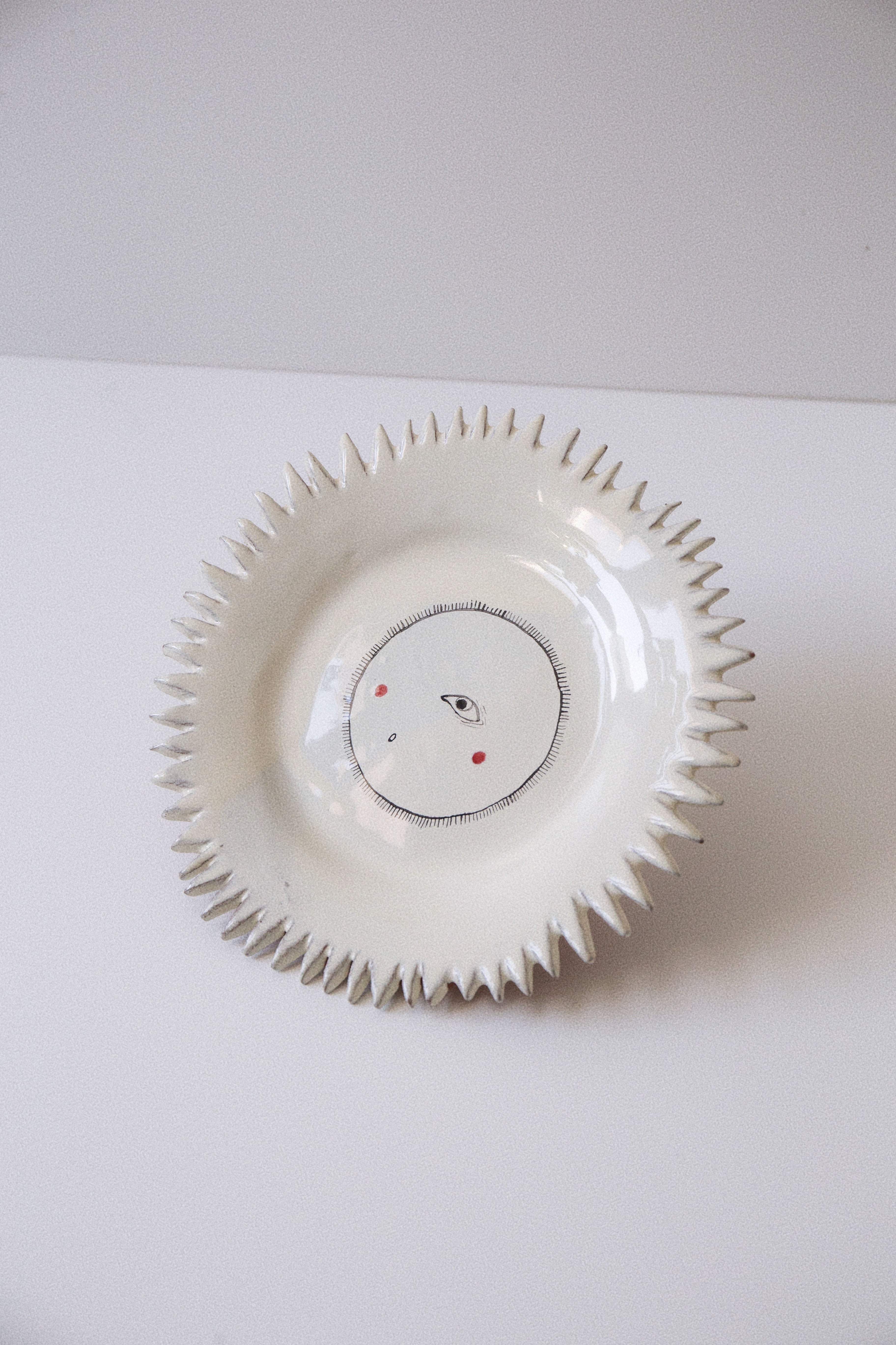 Sun Plate - a durable and lightweight plastic plate with a sun design