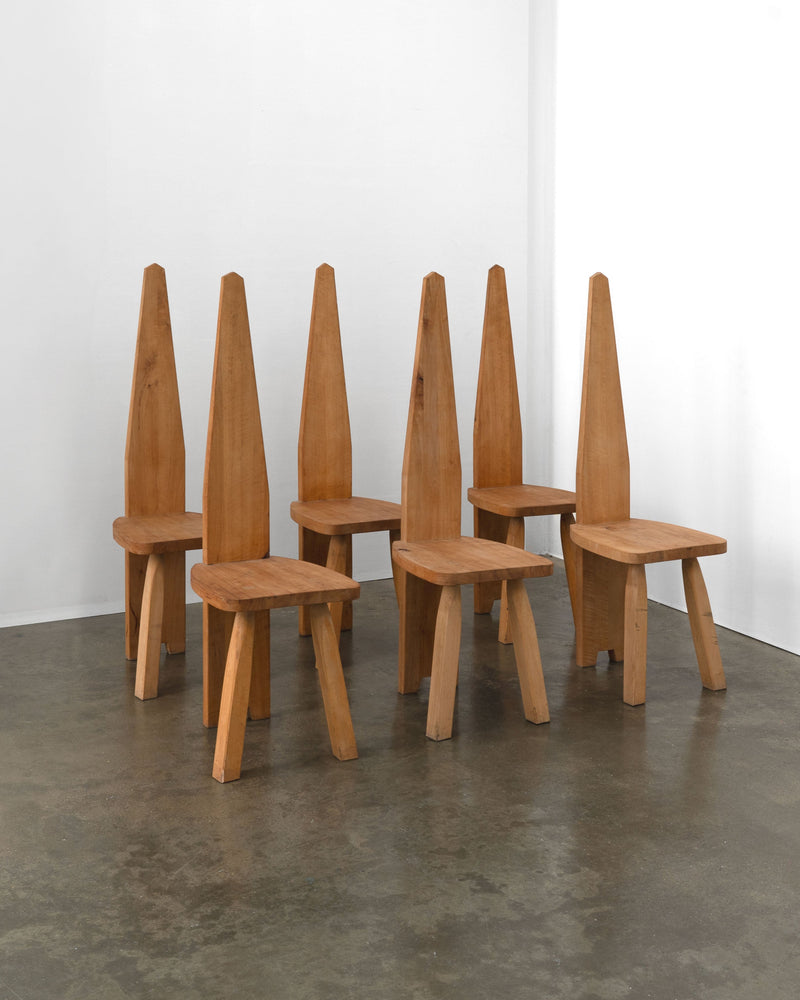 Six brutalist high back wooden chairs with tall angular backs