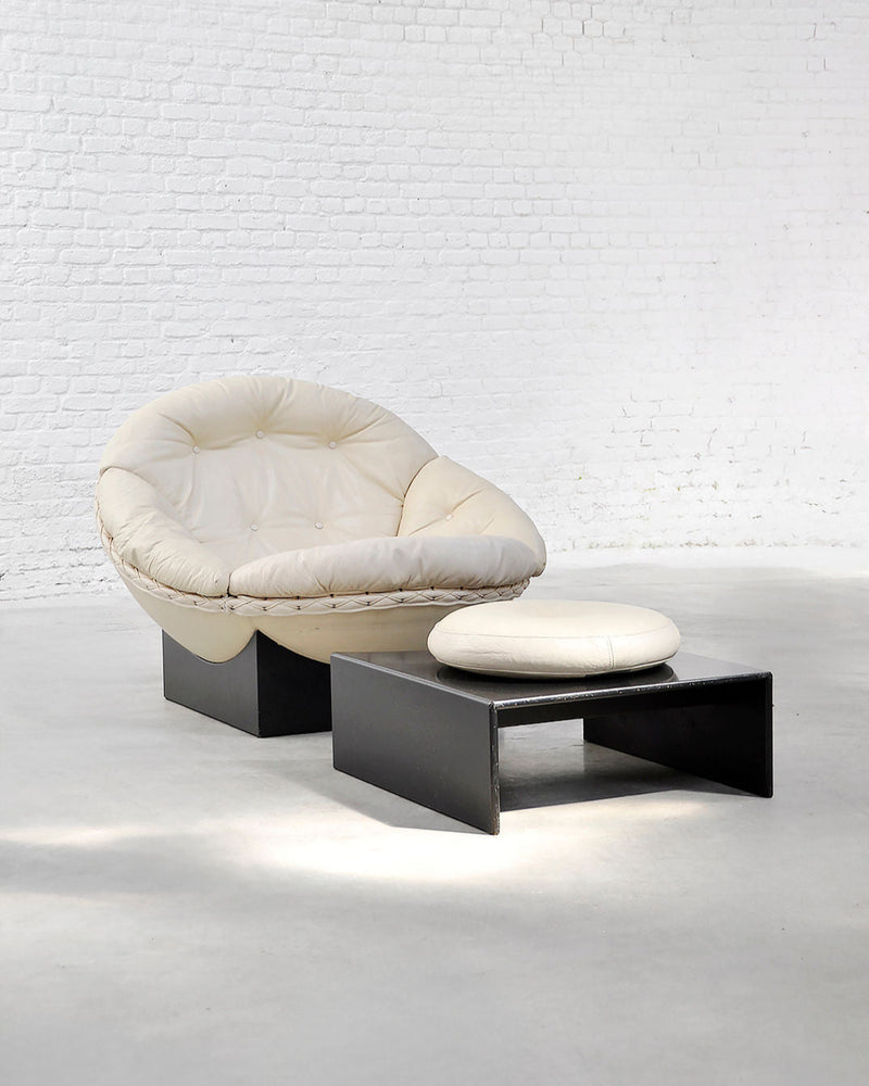 Vintage cream leather Apollo lounge chair with black base and ottoman