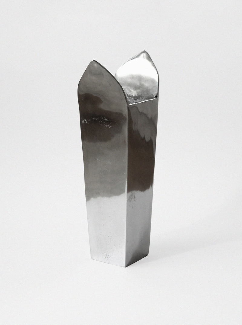 Contemporary polished aluminum tall vase with angular asymmetric top
