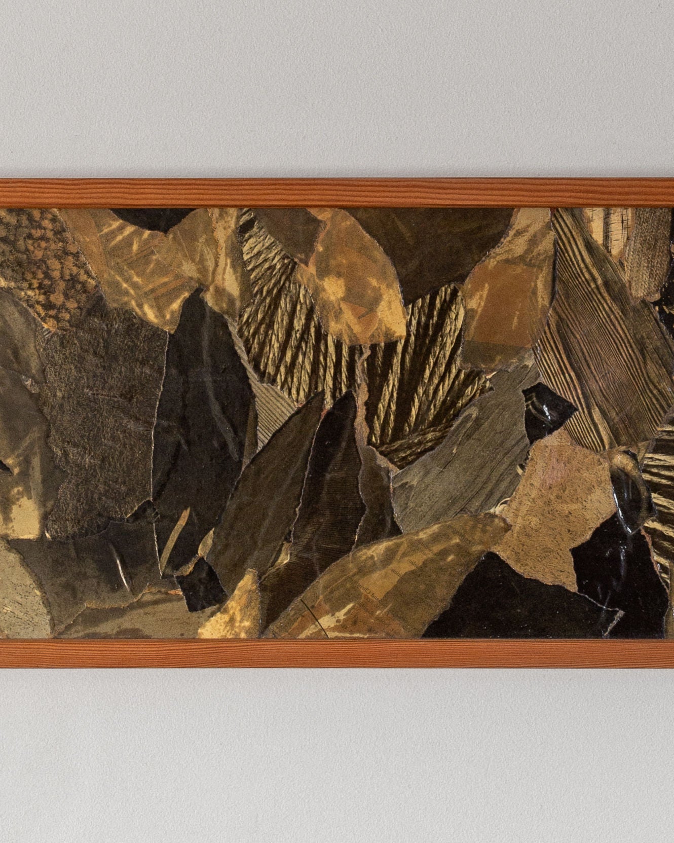 The "Leaves" collage by Lars Bergander, a mid-century modern piece from Sweden under brand Spigel, features a rectangle frame with warm medium wood tones. It showcases an abstract mix of textured earth-toned materials in dark and light brown, black, and gold.