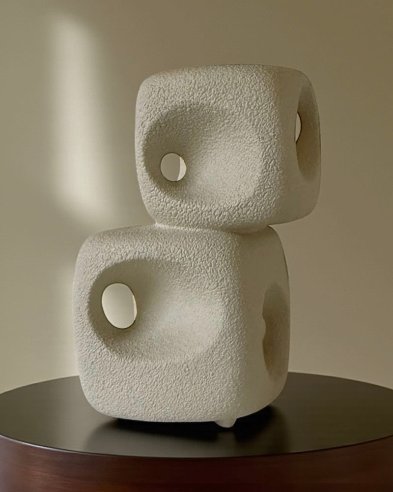 Two stacked cream ceramic dice vases with circular holes by Bertoncello