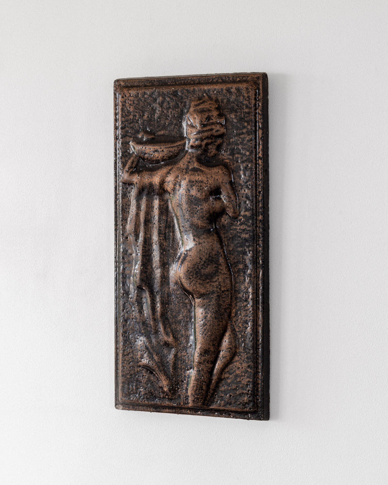 Vintage ceramic relief sculpture depicting standing female figure