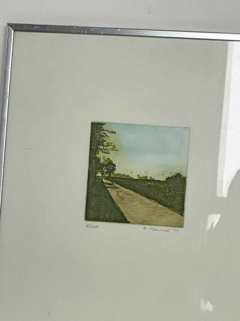 Framed artwork titled "Framed Landscape" by Porter Studio, depicting a serene path with trees and grassy fields under a blue sky. Numbered "53/110" and signed "A. Maxwell '77", it's displayed in a Nielsen chrome frame.