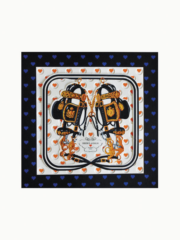 A stylish square scarf featuring an intricate design with pairs of black and gold harnesses, ornate golden details, and heart motifs. The border showcases alternating small red and blue hearts on a black background, with a central label stating "Brasil" and other text. Perfect for luxury brand aficionados or fans of the Hermès Pop Up Book by Maison Plage.