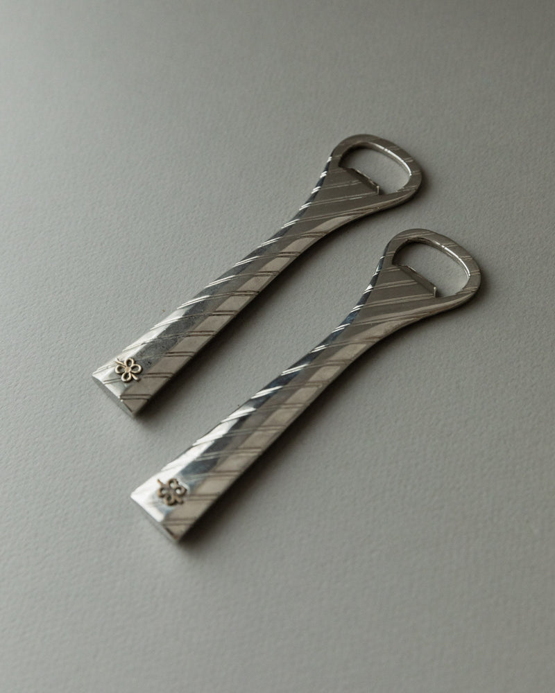 Vintage silver-plated bottle openers with twisted pattern detail