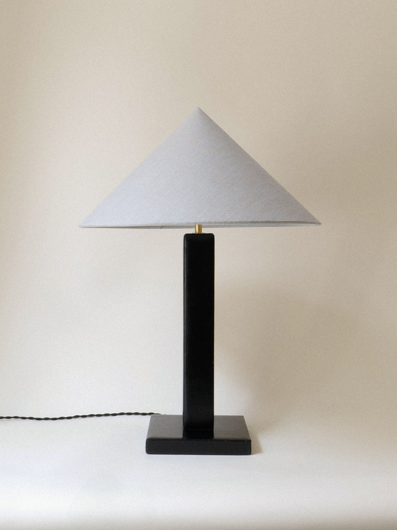 Black cylindrical base table lamp with white triangular shade 1950s