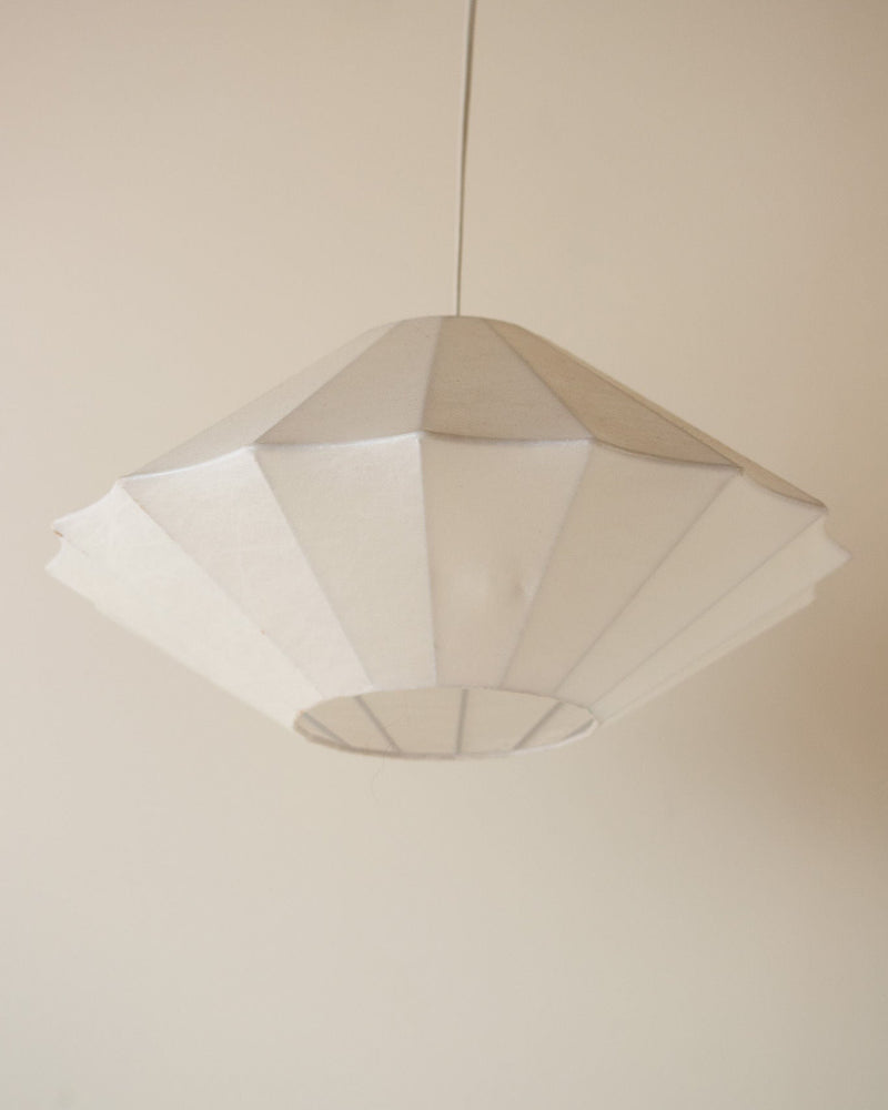 White fabric cocoon pendant light with geometric pleated shade