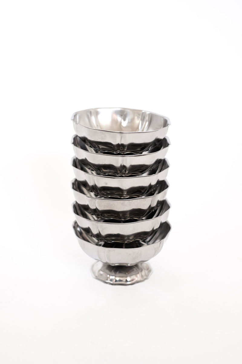 Set of six stacked stainless steel ice coupes with hammered finish