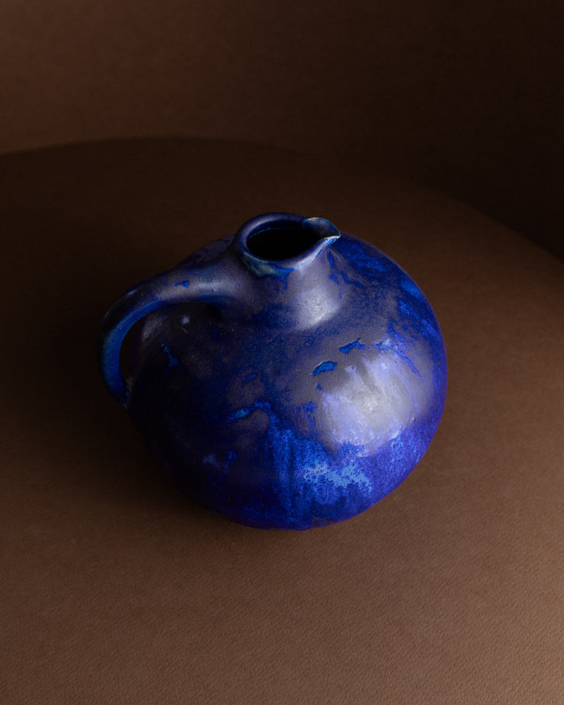 Blue ceramic vase detail showing mottled glaze by Otto Wichmann
