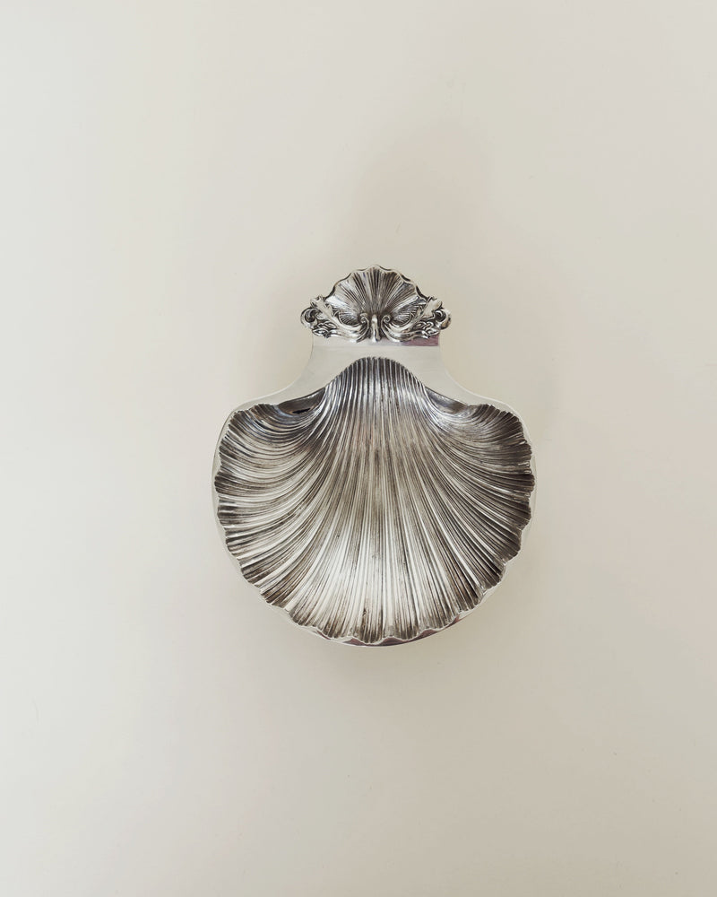 Vintage silver-plated shell dish with ornate decorative handle