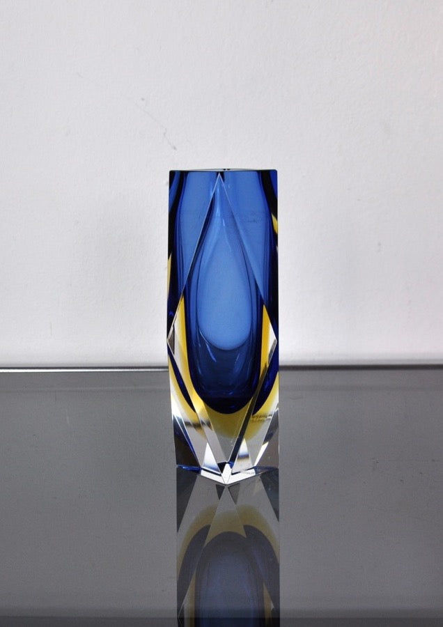 Blue Sommerso Murano glass vase with yellow accents on reflective surface