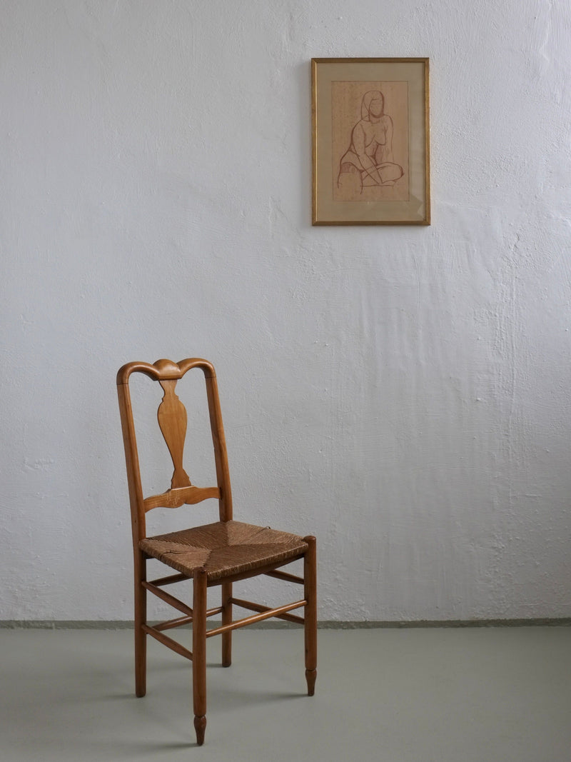 Modernist nude drawing lifestyle setting with vintage chair