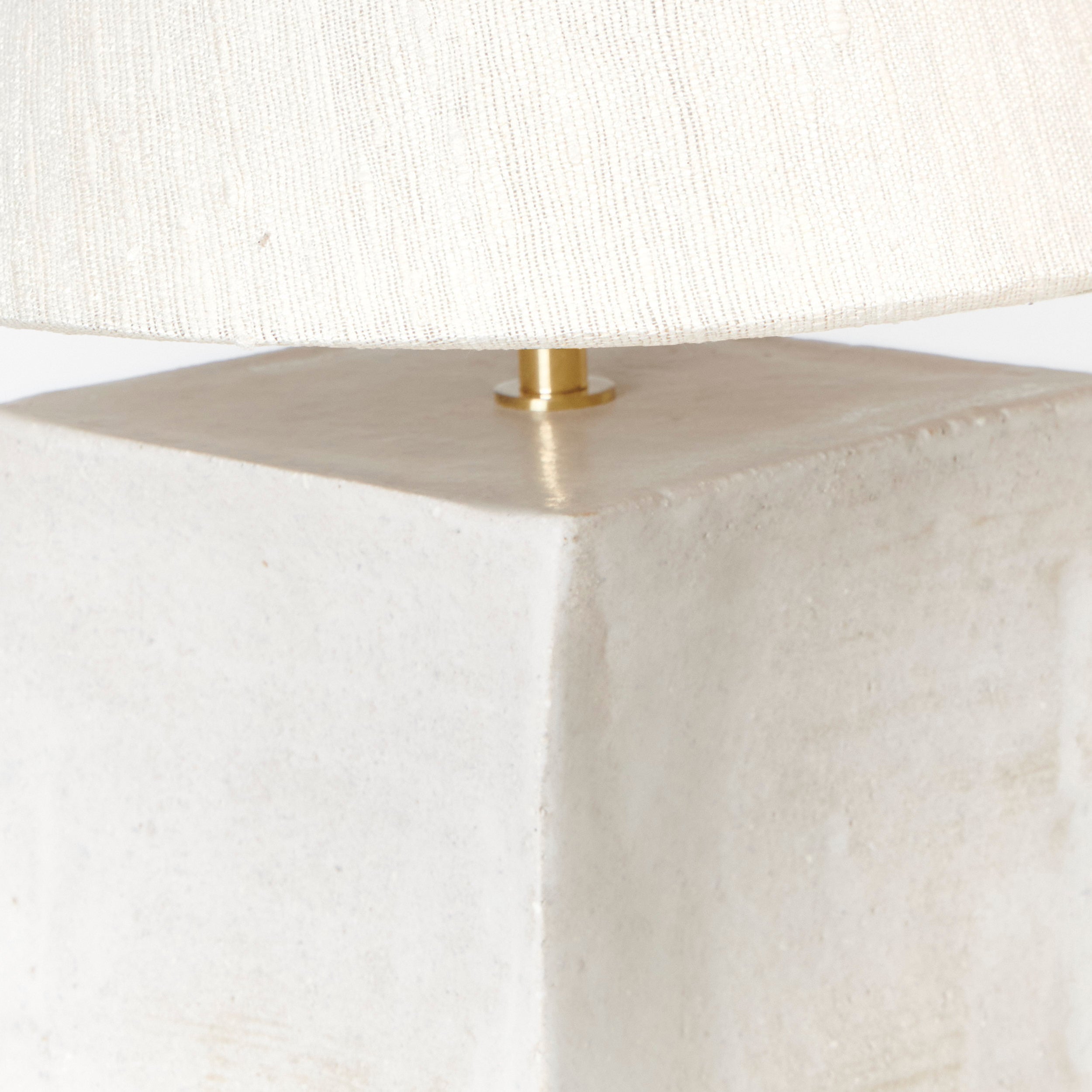 Close-up of the Arouca Table Light White by Project 213A, showcasing its textured off-white rectangular base and matching neutral fabric lampshade.