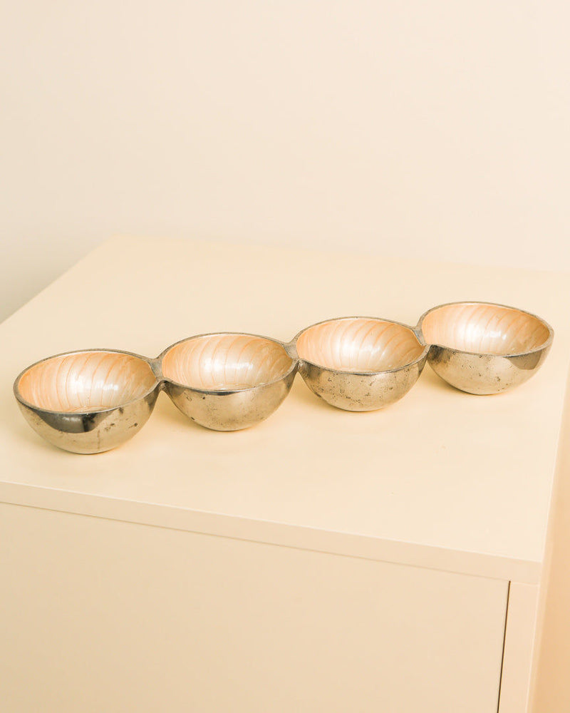 Four connected aluminum bowls forming Galassia vide-poche set